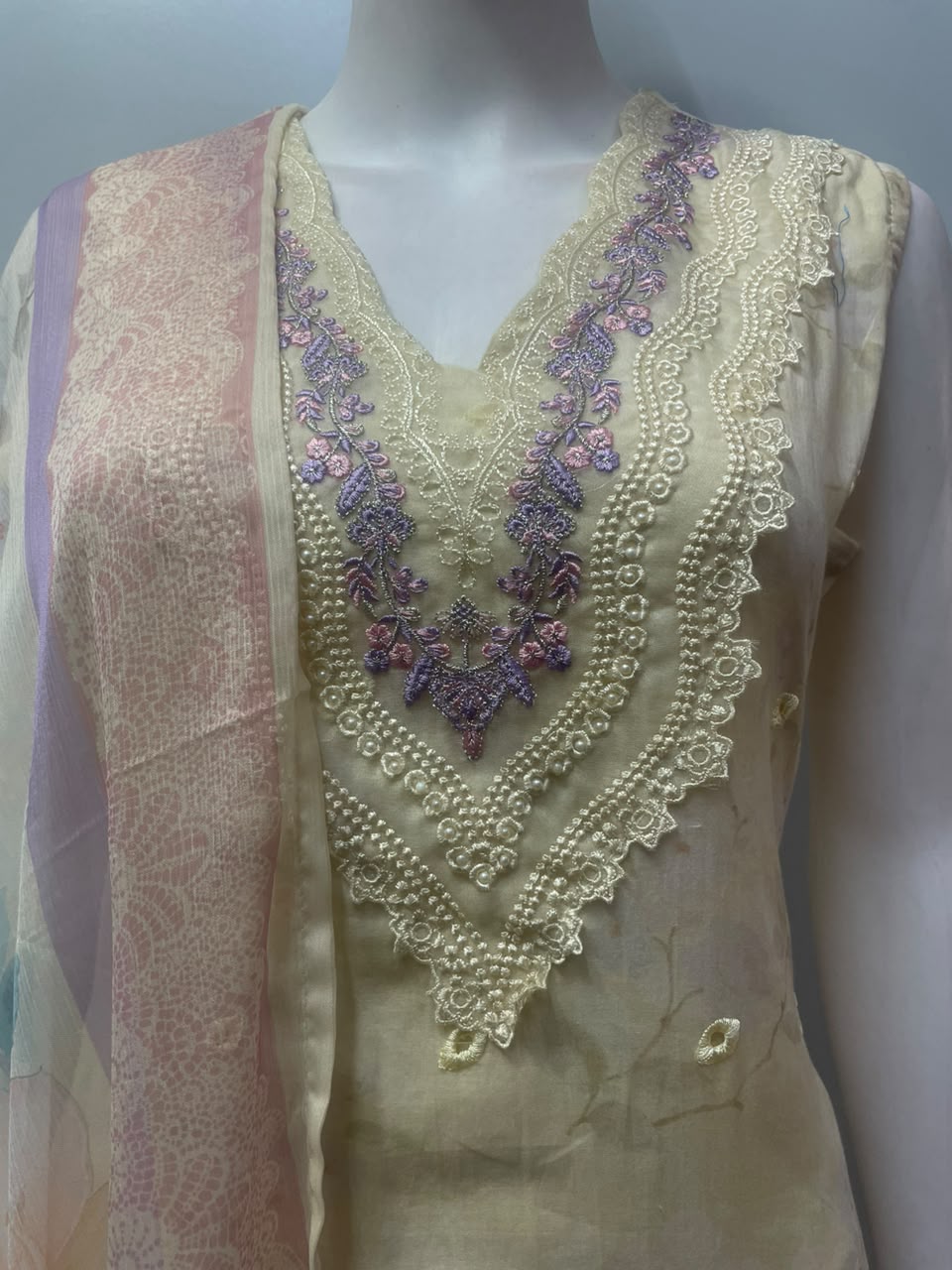 Back view of the lavender blossom ensemble with the dupatta over one arm