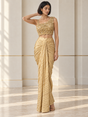 Golden champagne skirt set with an asymmetric floral blouse and metallic crinkled draping