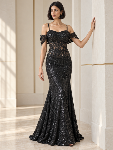 Jet black sequin fishtail skirt with a sheer geometric corset top, front view