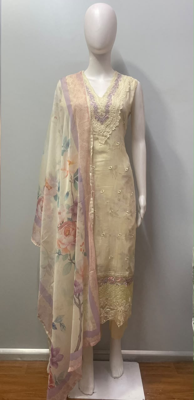 Detail of the lavender thread blossoms scattered across the kurta sleeve