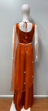 Burnt orange crop top and palazzo set styled for a festive evening