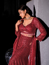 Sweetheart-neck wine blouse above the fitted-to-flared lehenga hem
