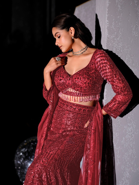 Sweetheart-neck wine blouse above the fitted-to-flared lehenga hem