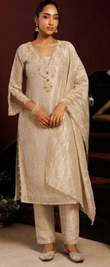 Ivory champagne kurta set with pearl beadwork and a softly draped dupatta