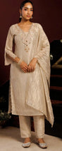 Ivory champagne kurta set with pearl beadwork and a softly draped dupatta