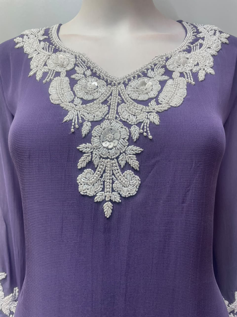 Side view of the lavender lace kurta showing the hem and trouser length