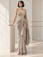 Champagne taupe draped saree set with a pearl-detailed corset blouse and cascading folds