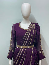 Full-length view of a wine and gold ruffle saree set