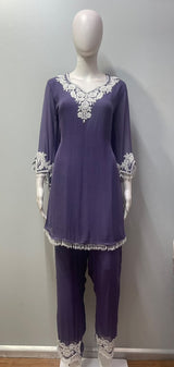 Close view of the white lace embroidery on the lavender kurta bodice