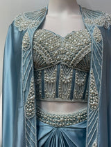 Ice blue cape saree set in sheer tonal fabric with a pleated pallu