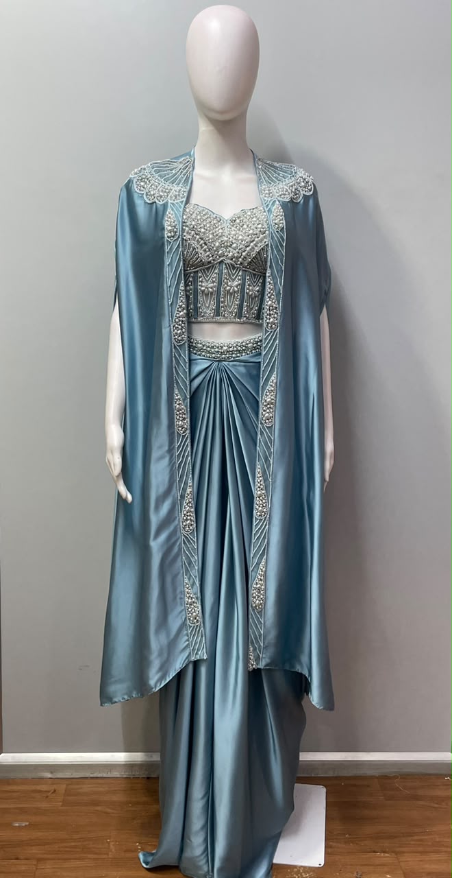 Ice blue pre-draped saree set with a pearl-worked blouse and sheer cape