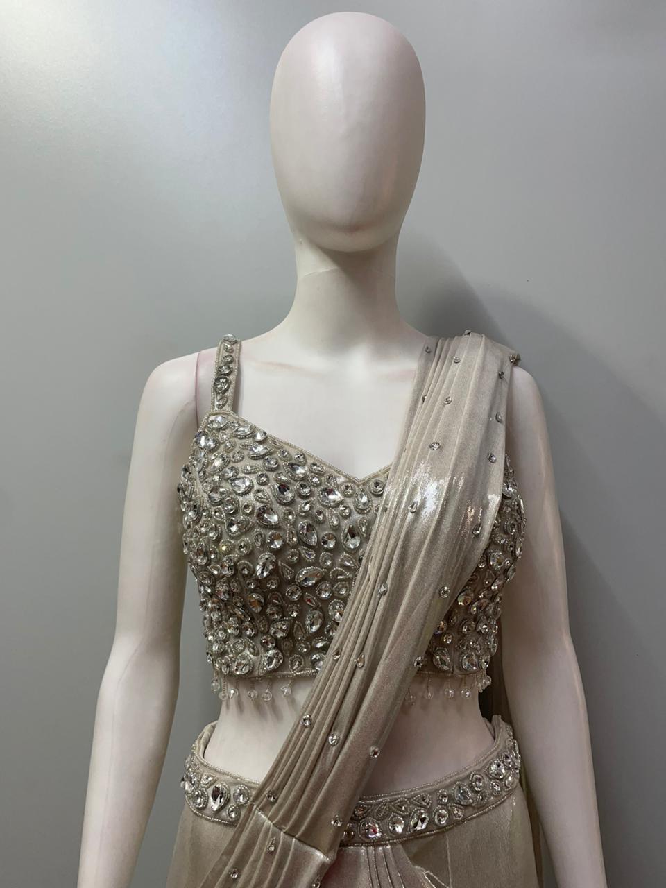 Full-length view of a champagne crystal pre-draped saree set