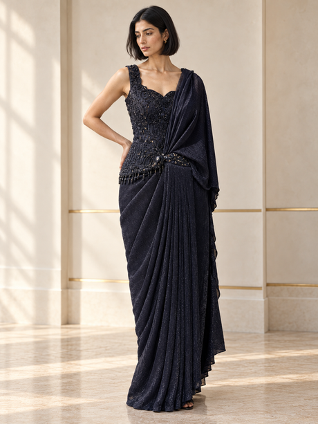 Midnight navy draped saree set with a paisley beaded blouse and softly shimmering pleats