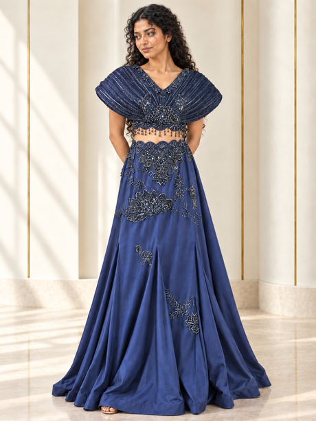 Midnight blue skirt set with a sculpted floral-beaded cape top, front view