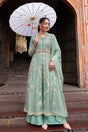 Silver beadwork and botanical embroidery framing the seafoam jacket bodice