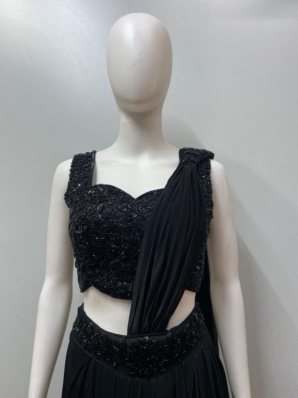Full-length view of a black sequin pre-draped saree set