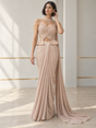 Blush champagne draped saree set with a pearl-detailed peplum blouse and a trailing drape