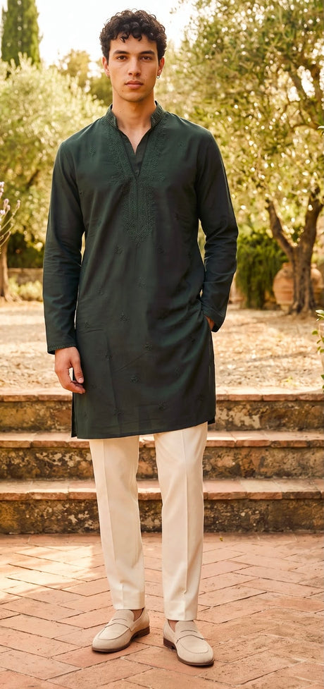 Deep forest green men's kurta set with tonal neckline detailing and ivory straight-cut trousers