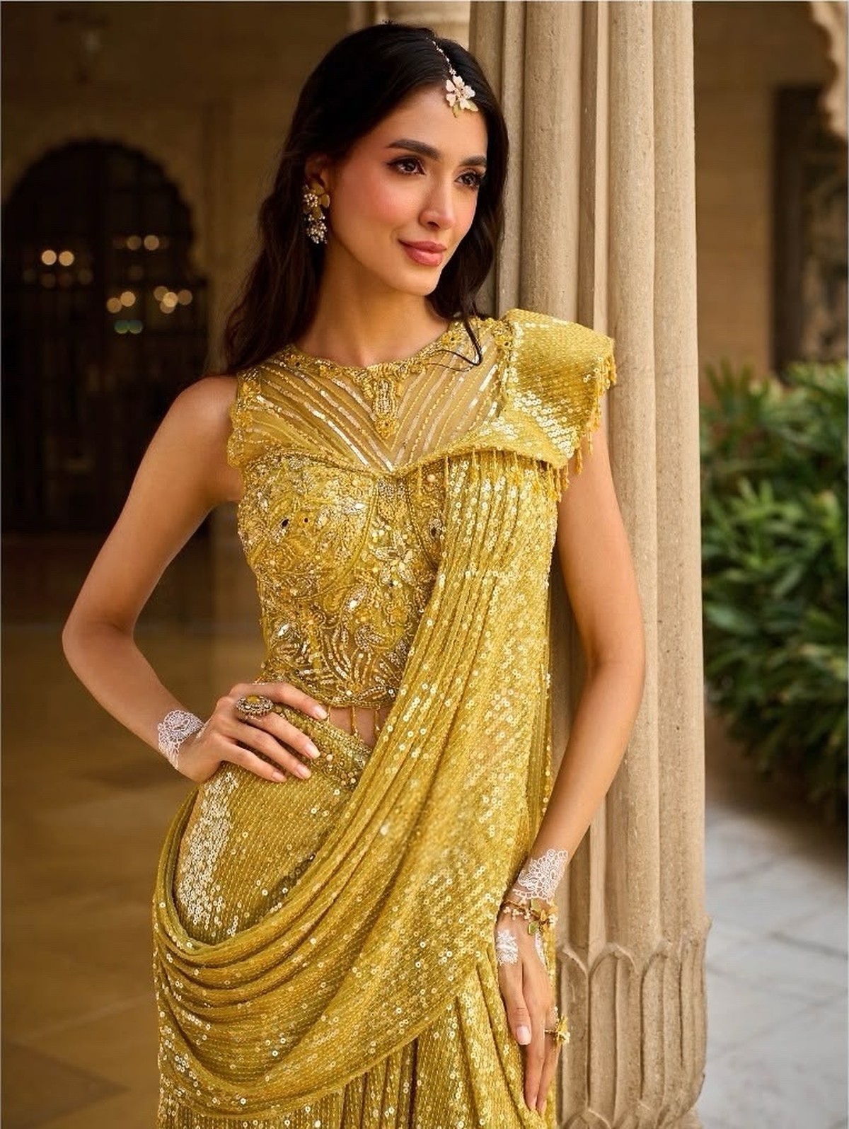 Floor-length sunflower gold draped skirt catching the light