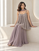 Smoky lilac palazzo set with silver mirrorwork, decorative straps and a flared kurta