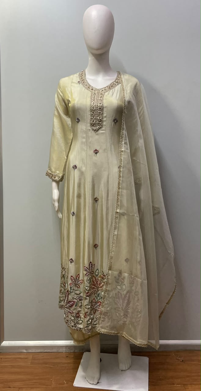 Close view of the floral thread work on the champagne beige kurta