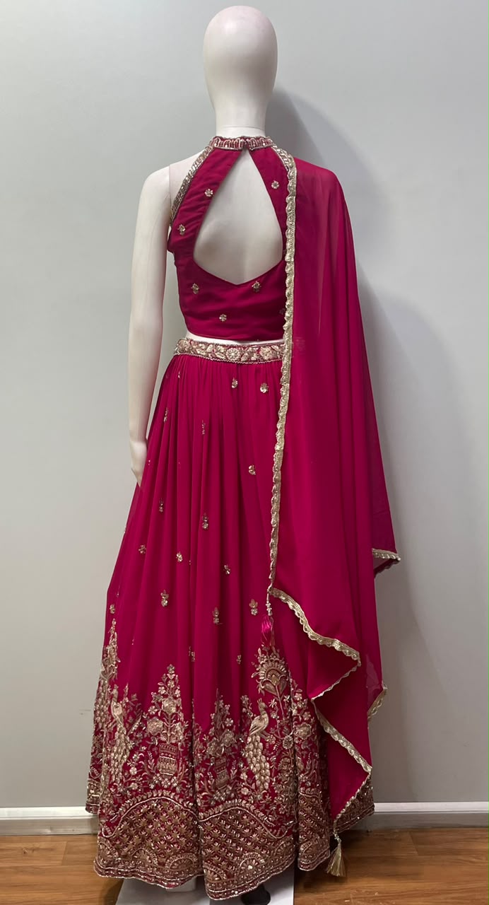 Rani pink lehenga with gold peacock embroidery and a matching embroidered blouse