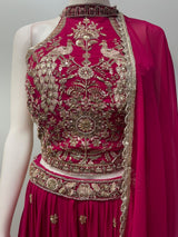Side view of the rani pink peacock lehenga showing the skirt flare and hem border