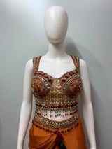 Detail of the drape and hem on a copper rust embellished skirt