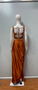Copper rust draped skirt set styled for an evening celebration