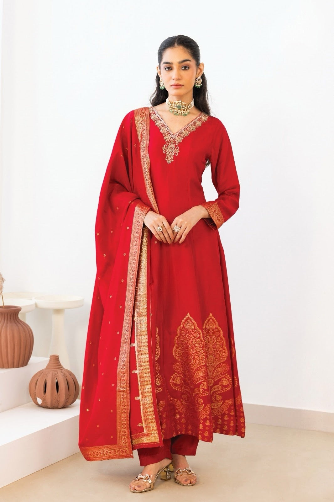 Crimson red kurta set with an antique gold paisley motif and matching dupatta