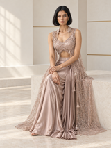 Dusty rose skirt set with a pearl-detail blouse, draped skirt and sheer floral cape