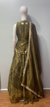 Olive lehenga ensemble featuring sweeping gold botanical motifs