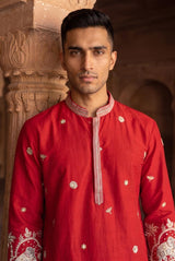 Statement botanical embroidery on the cuff of the crimson men's kurta