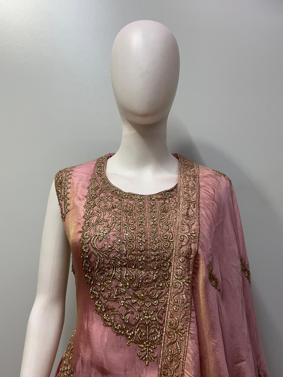 Full-length view of a dusty rose antique zari lehenga set