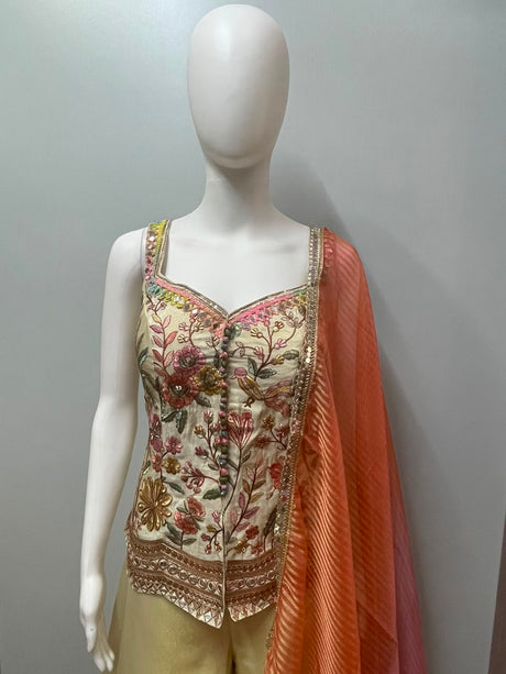 Full-length view of an ivory floral mirror palazzo and dupatta set