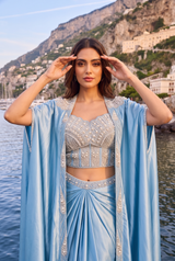 Close view of the pearl detailing on an ice blue cape and saree