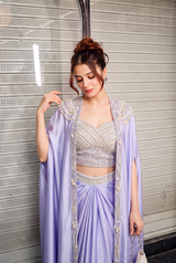 Full-length view of a lilac pearl cape saree set on the model