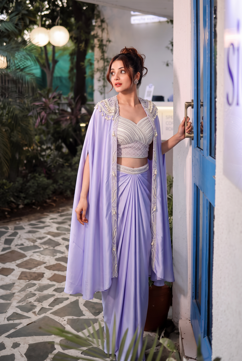Lilac saree worn with a pearl detailed cape and fitted blouse