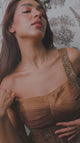 Copper bronze corset saree set shown in movement on the model