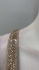 Champagne taupe crystal draped skirt set shown in movement on the model