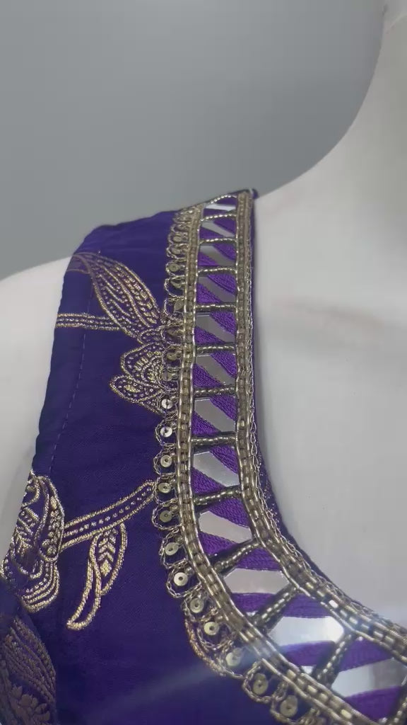 Royal purple gold embroidered palazzo set shown in movement on the model