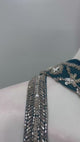 Teal embroidered layered sharara set shown in movement on the model