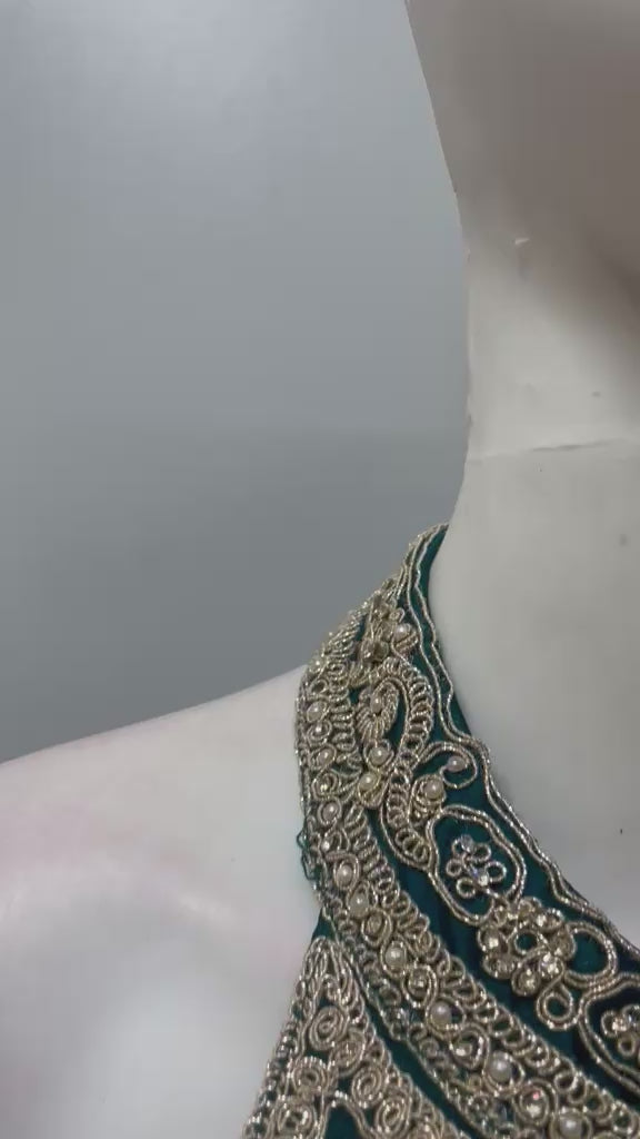 Emerald gold flared anarkali set shown in movement on the model
