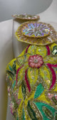 Sunshine yellow floral palazzo drape set shown in movement on the model