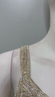 Champagne pearl draped saree set filmed from the front and side