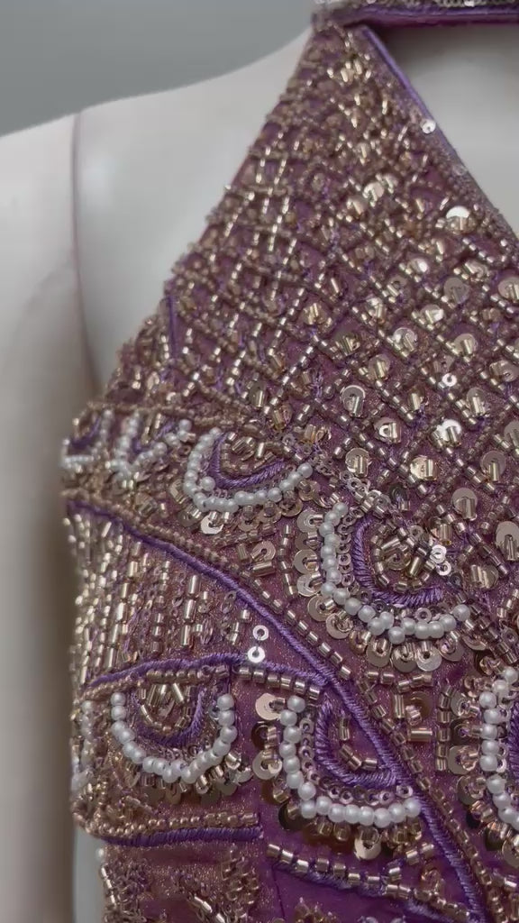 Mauve bronze embellished draped saree shown in movement on the model