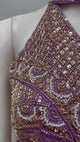 Mauve bronze embellished draped saree shown in movement on the model