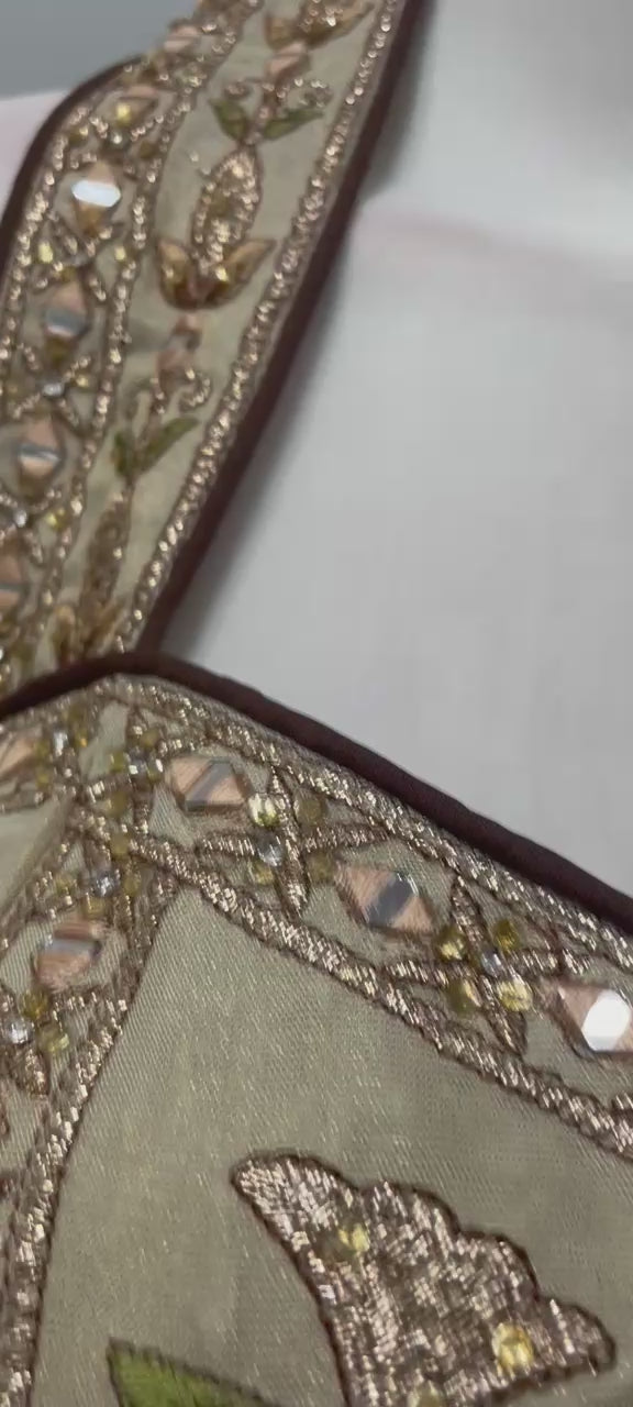 Ivory gold corset embroidered lehenga shown in movement on model