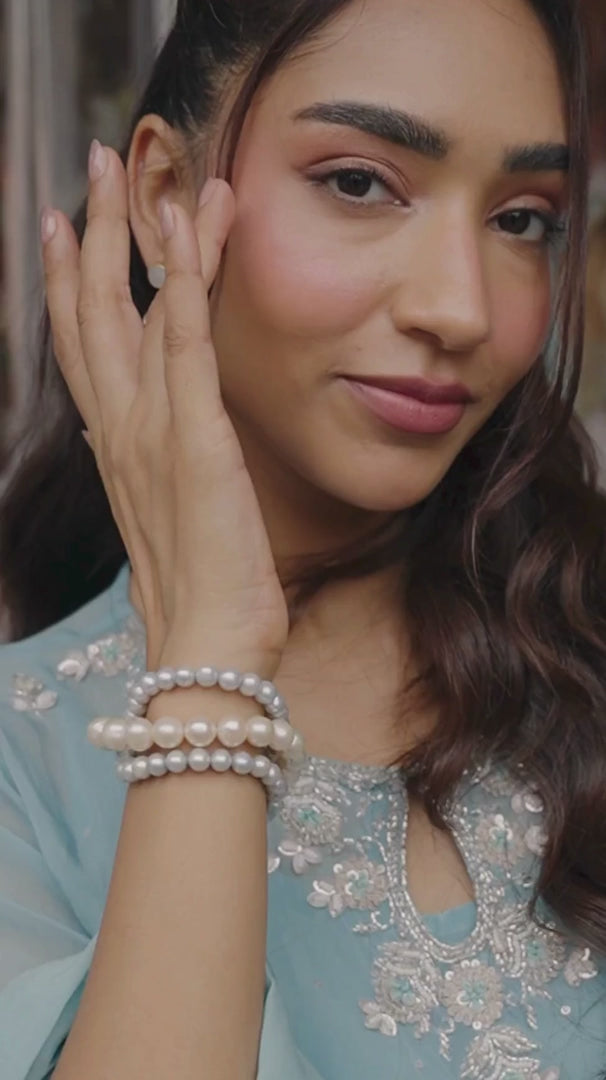Powder blue embroidered salwar suit shown in movement on the model