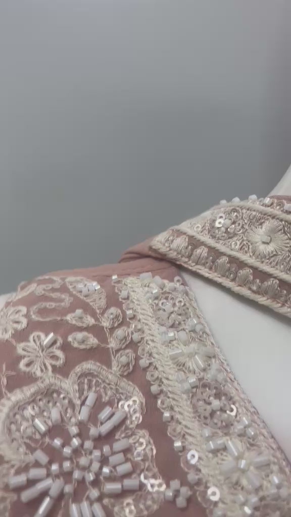 Dusty rose pearl-beaded palazzo set shown in movement on the model